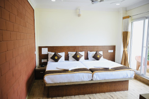 Front view of Hotel Parijatha Inn Dharmasthala — main entrance with traditional architecture