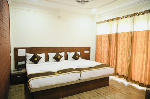 AC room at Hotel Parijatha Inn Dharmasthala — comfortable double room