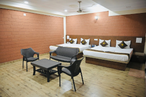 Hotel Parijatha Inn room — well-maintained accommodation near Dharmasthala Temple