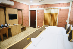 Hotel room at Parijatha Inn — spacious family room option