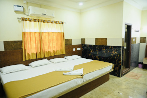 Family group room at Hotel Parijatha Inn Dharmasthala — spacious for 4 to 8 guests