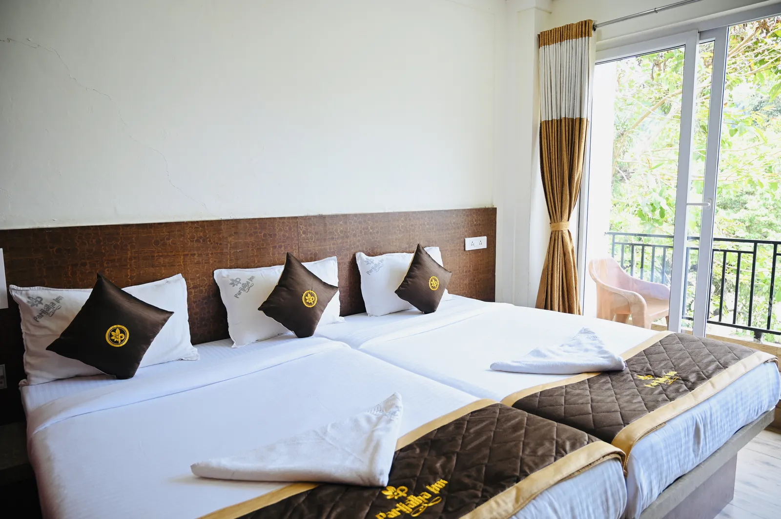 AC triple room with balcony view at Hotel Parijatha Inn