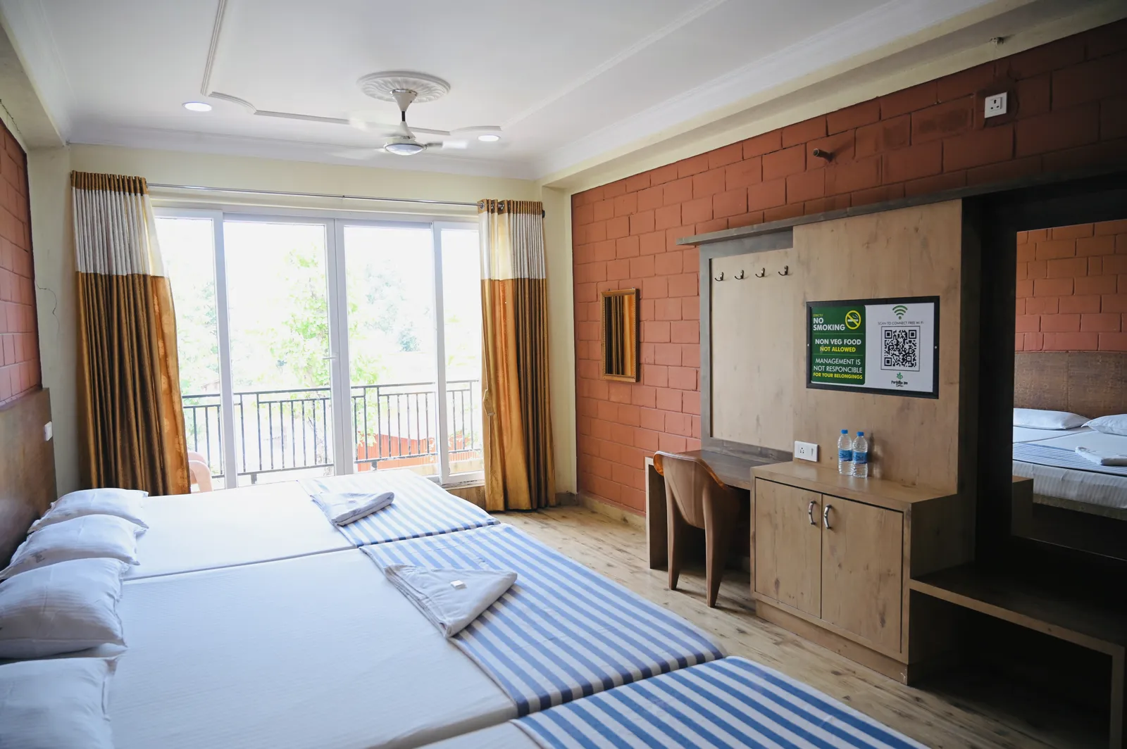 Spacious family group room for 4 to 8 guests with dressing area